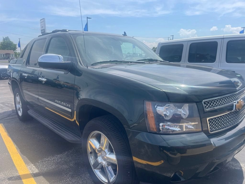 2013 Chevrolet Avalanche LTZ in Fairway Metallic — front three-quarter view